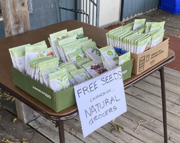 a table with a large box of seeds