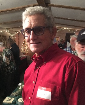 John Falvey smiling at the annual Sunshine Holiday Party